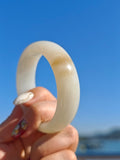 Certificate-certified Hetian white jade bangle with sugar-like inclusions | 56 mm in diameter, 18.4 mm thick.